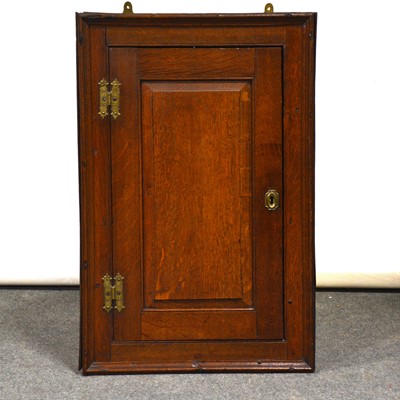 Lot 410 - George III oak hanging corner cupboard