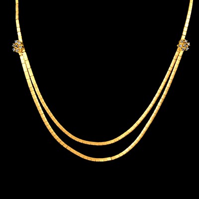 Lot 220 - A sapphire and yellow metal necklace.
