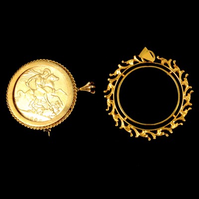 Lot 218 - A yellow metal coin mount, and gold-plated crown coin pendant.