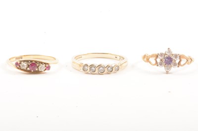 Lot 113 - Three gemset rings.