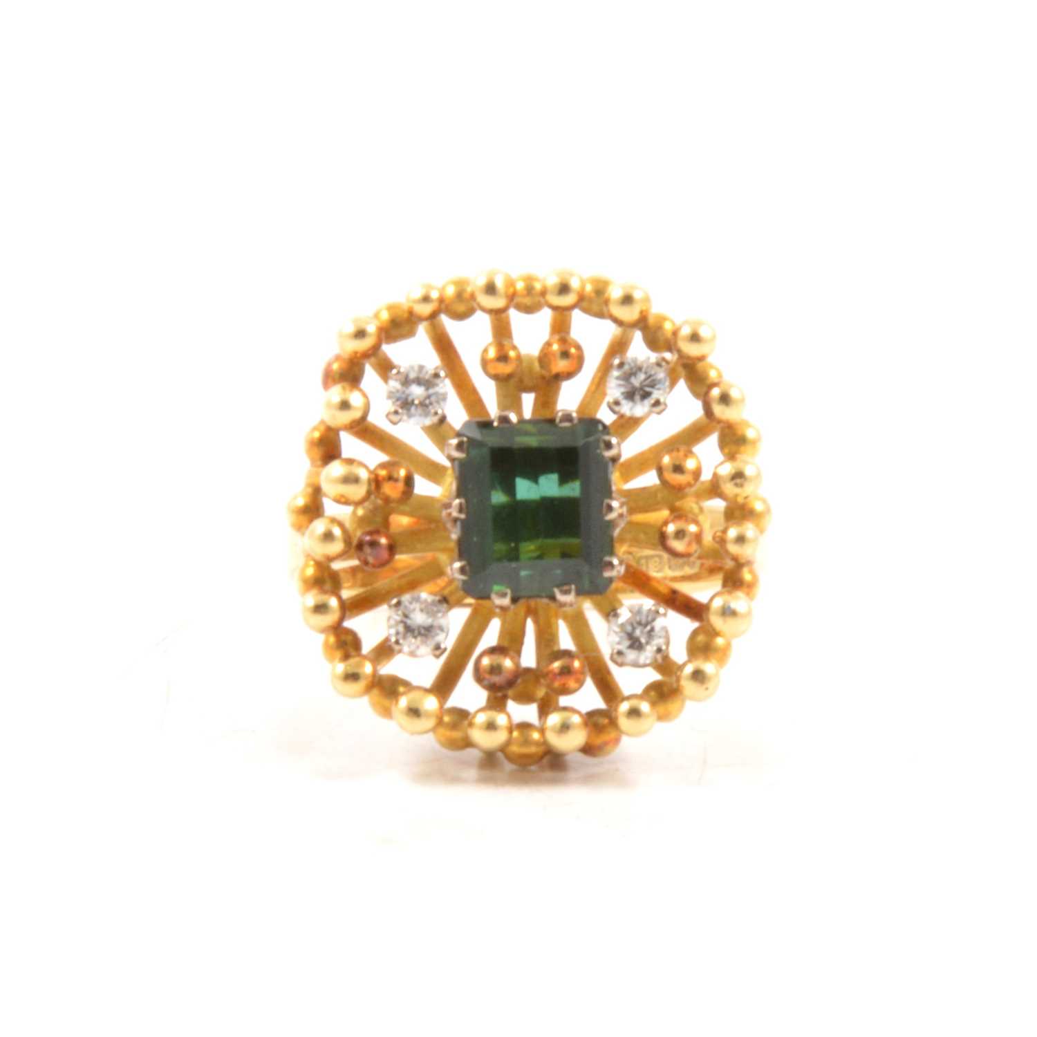 Lot 75 - Thomas Payne and Peter Triggs - a 1970's green tourmaline and diamond ring.
