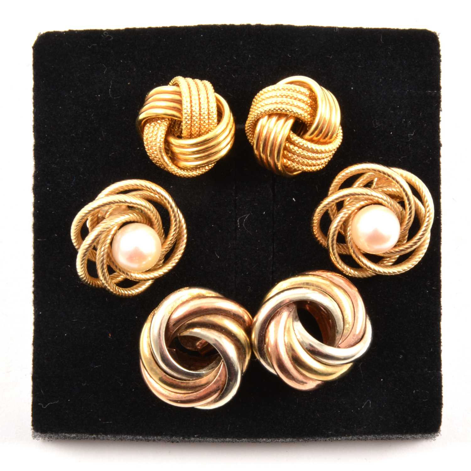 Lot 168 - Three pairs of 9 carat gold knot design earrings.