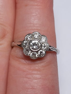 Lot 12 - A diamond cluster ring.