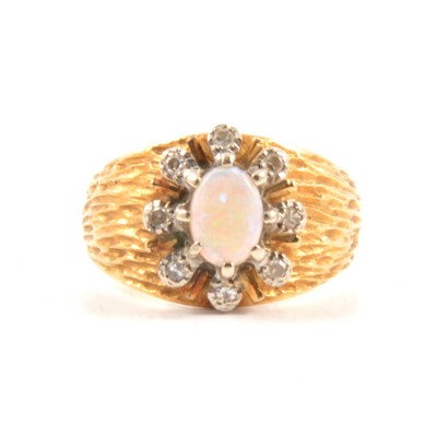 Lot 77 - An opal and diamond cluster ring.