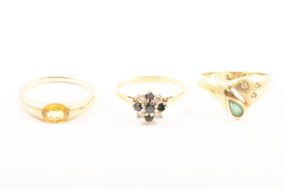 Lot 119 - Three gemset rings.