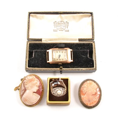 Lot 277 - A 9 carat yellow gold wristwatch, simulated pearl ring, paste ring, and two cameo brooches.