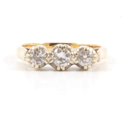 Lot 16 - A diamond three stone ring.