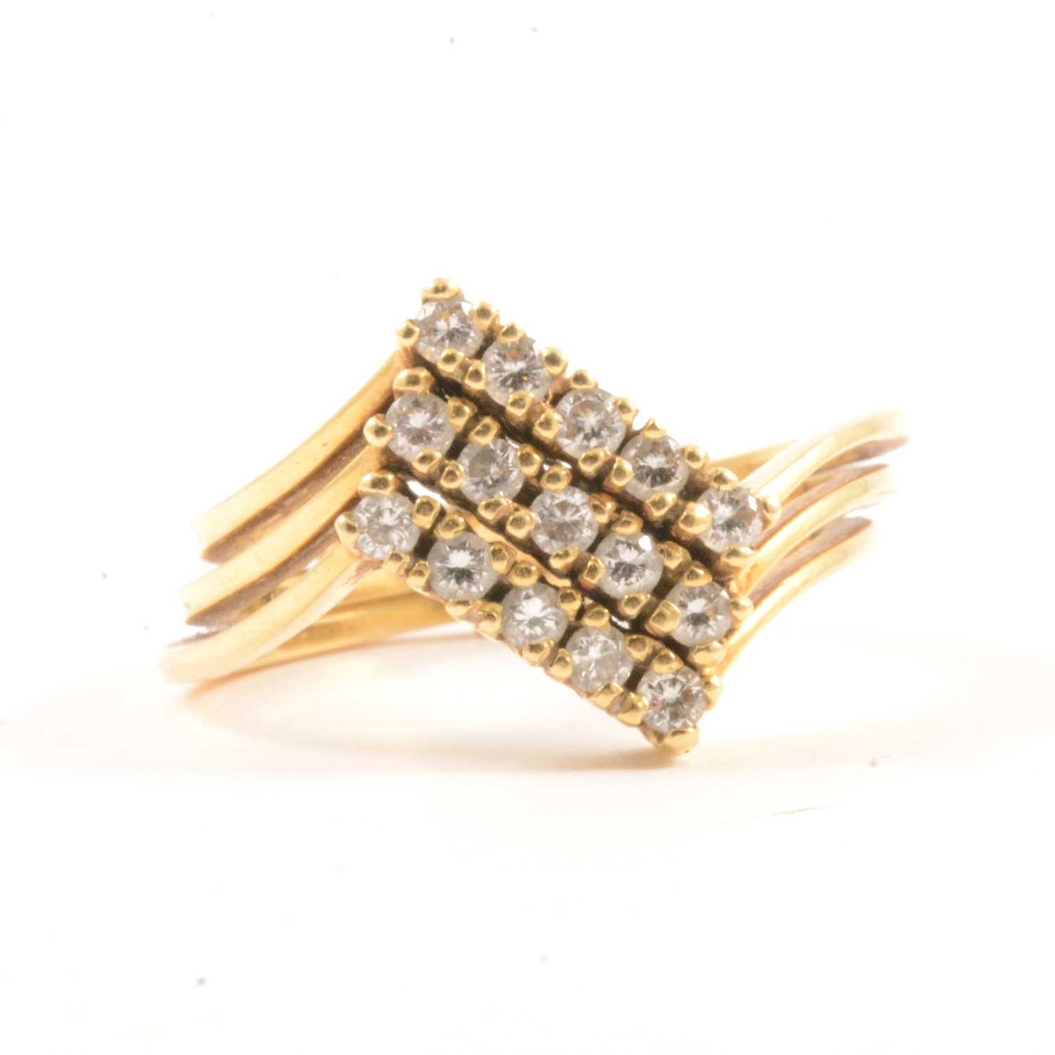 Lot 19 - A diamond puzzle ring.