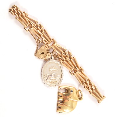 Lot 188 - A 9 carat gold gate link bracelet and elephant charm.