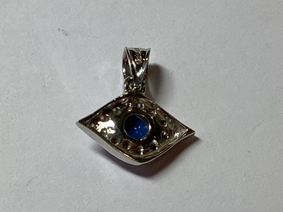 Lot 232 - An 18 carat white gold Eye charm.