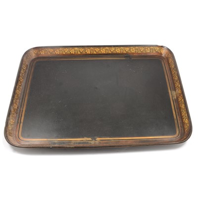 Lot 360 - A large black ebonised papier mache tray with gilded grape and vine border.