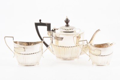 Lot 235 - A silver three piece bachelor teaset by Charles Boyton (II).