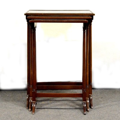 Lot 697 - Nest of three mahogany occasional tables and a coffee table