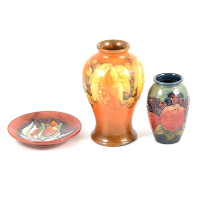 Lot 48 - Moorcroft Pottery - a 'Finches and Fruit' vase, a 'Tulip' pin dish, and a 'Leaf and Berry' vase