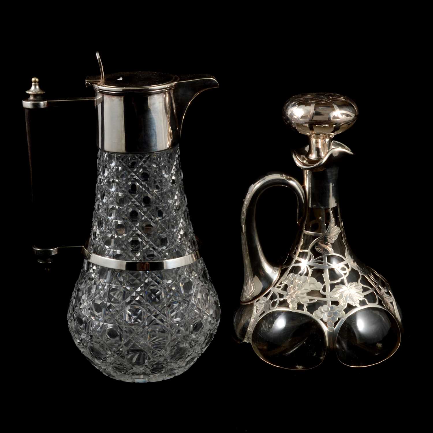 Lot 296 - Art Nouveau silver overlaid glass decanter and a cut glass decanter with silver plated mounts