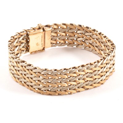 Lot 182 - A 9 carat yellow and white gold herringbone bracelet.