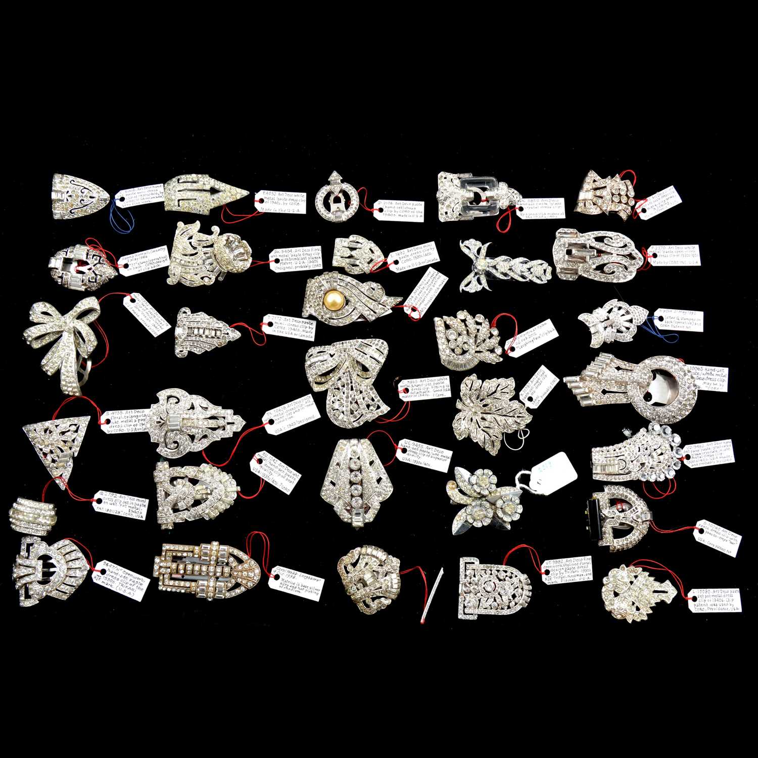 Lot 481 - Thirty Art Deco paste set dress clips.