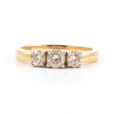 Lot 6 - A diamond three stone ring.