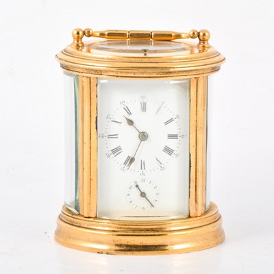 Lot 387 - French brass oval carriage clock