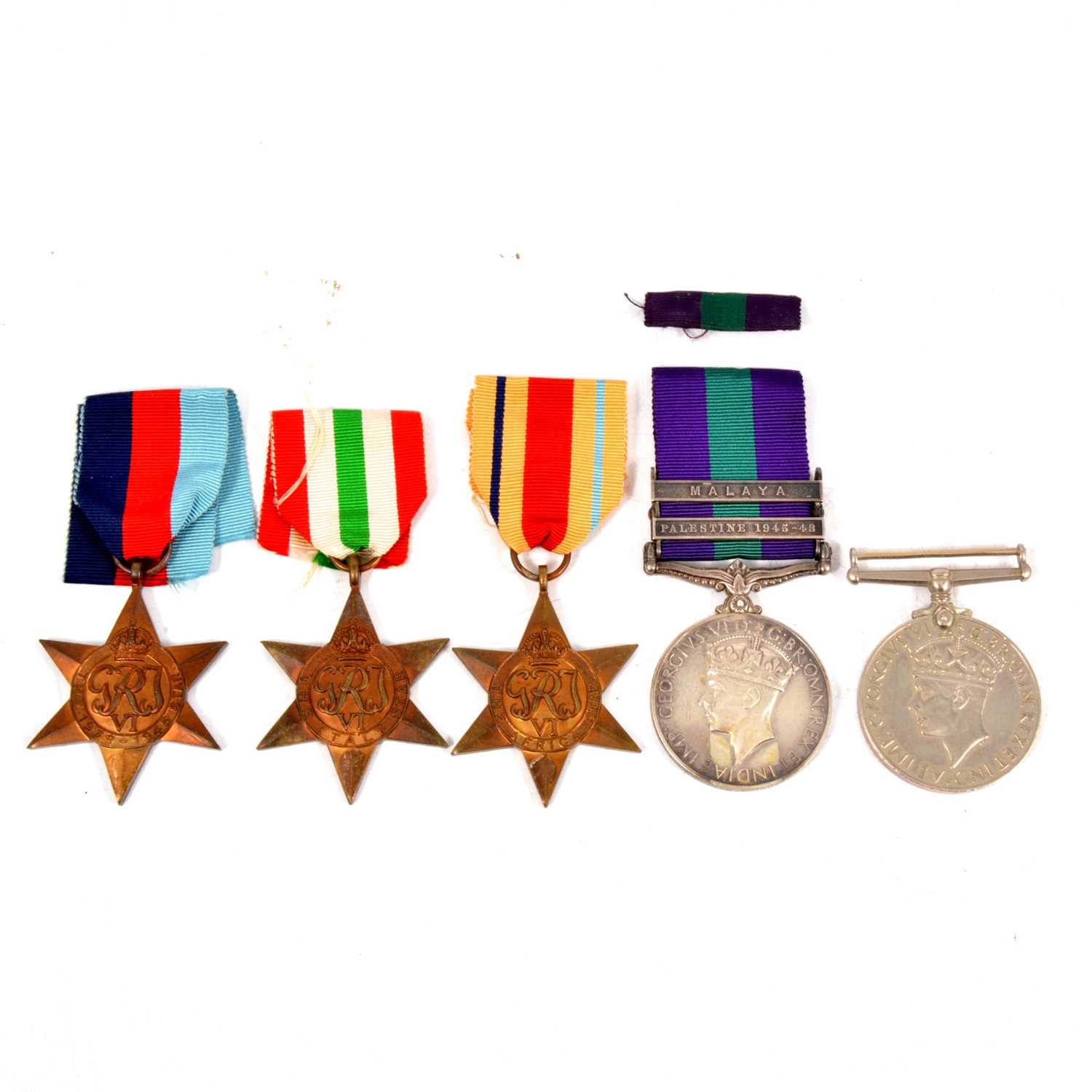 Lot 251 - Medals - Four WW2 medals, and a General Service Medal with bars.