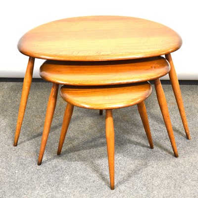 Lot 424 - Ercol, a nest of three 'Pebble' occasional tables