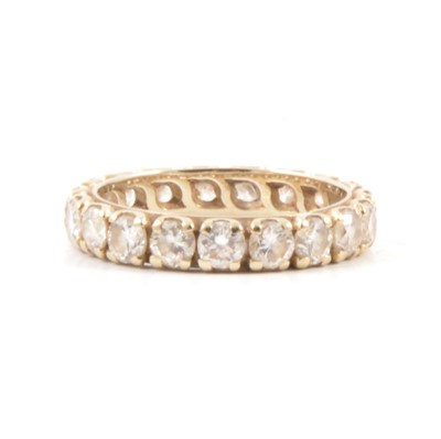 Lot 28 - A diamond full eternity ring.