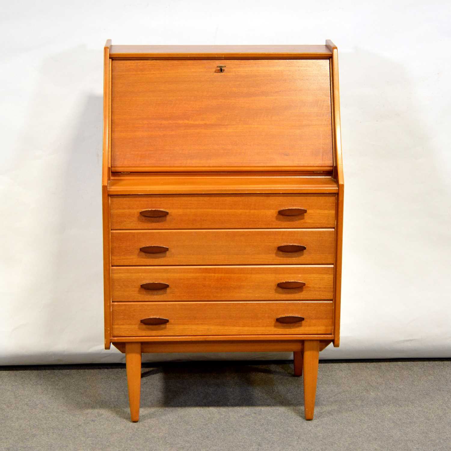 Lot 496 - Two Lloyd Loom bedroom chairs and a teak bureau