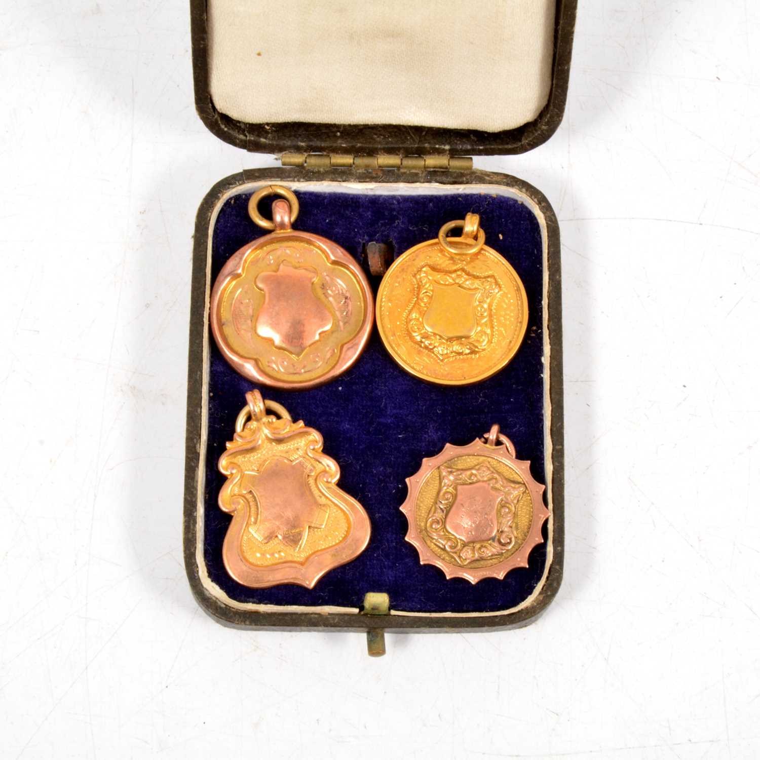 Lot 252 - Bletchley Hospital 9ct gold fob and three others