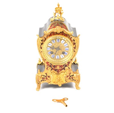 Lot 111 - A Mappin & Webb Boulle style twin train mantel clock.