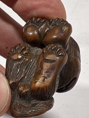 Lot 256 - Japanese carved wooden netsuke, designed as a tiger