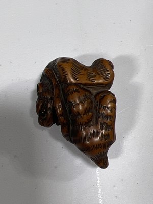 Lot 256 - Japanese carved wooden netsuke, designed as a tiger