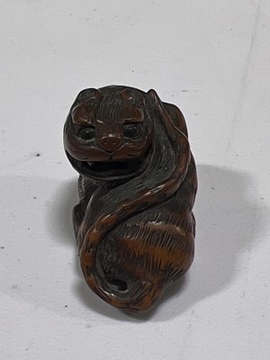 Lot 256 - Japanese carved wooden netsuke, designed as a tiger