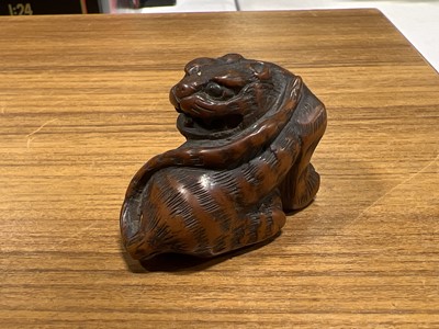 Lot 256 - Japanese carved wooden netsuke, designed as a tiger
