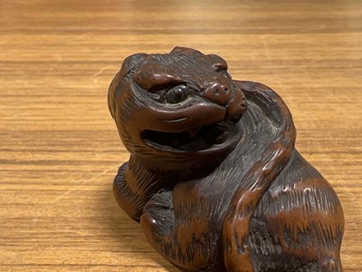Lot 256 - Japanese carved wooden netsuke, designed as a tiger