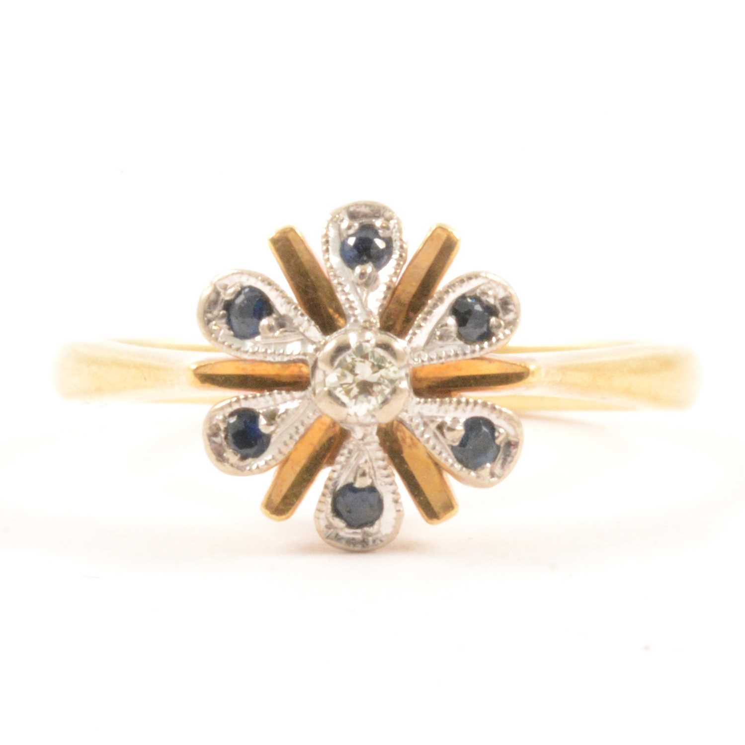 Lot 53 - A sapphire and diamond cluster ring.