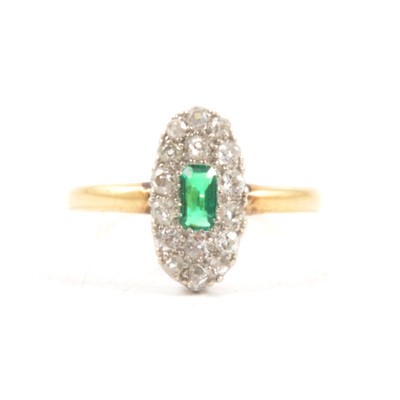 Lot 73 - A diamond cluster ring with synthetic green stone.