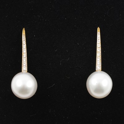 Lot 161 - A pair of pearl and diamond earrings.