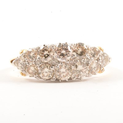 Lot 18 - A diamond boat shape cluster ring.