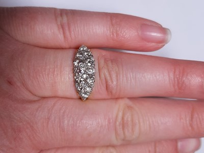 Lot 18 - A diamond boat shape cluster ring.