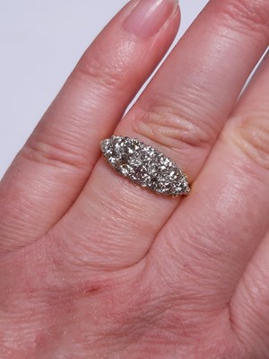 Lot 18 - A diamond boat shape cluster ring.