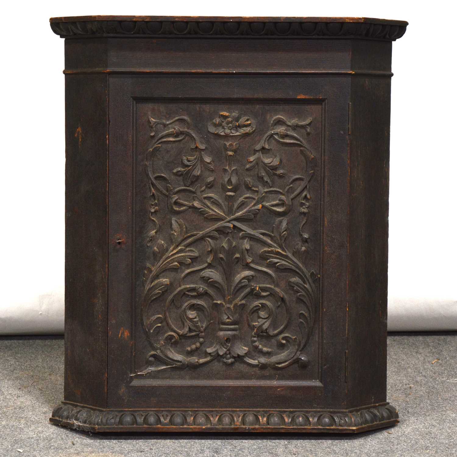 Lot 478 - Small carved oak hanging corner cupboard