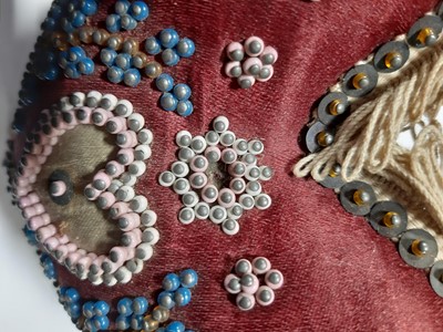 Lot 275 - A heart shaped beaded pin cushion, Royal Horicultural Society medal, baby's rattle and other silver.