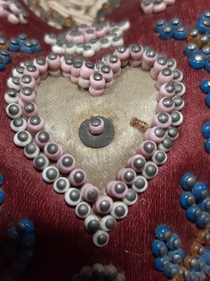 Lot 275 - A heart shaped beaded pin cushion, Royal Horicultural Society medal, baby's rattle and other silver.