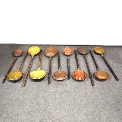 Lot 501 - Quantity of eleven copper and brass warming pans