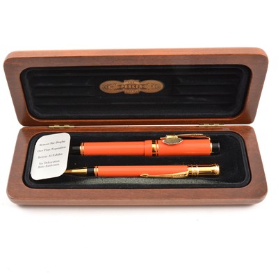 Lot 427 - Parker - A Centennial Duofold Coral Fountain Pen and Pencil Set.