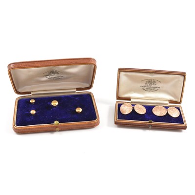 Lot 281 - A pair of 9 carat rose gold cufflinks and stud, stud set one missing.