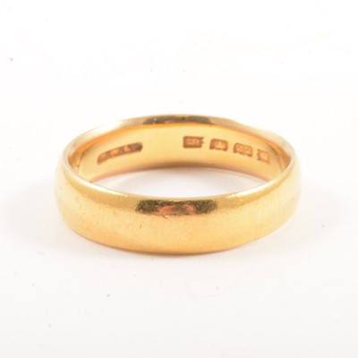 Lot 103 - A 22 carat yellow gold wedding band.