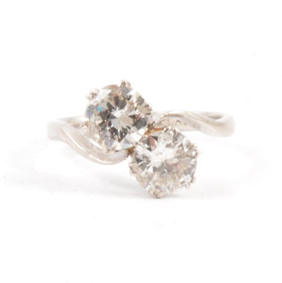 Lot 12 - A diamond two stone crossover ring.