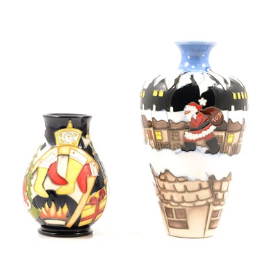 Lot 699 - Moorcroft Pottery, two Christmas themed trial vases