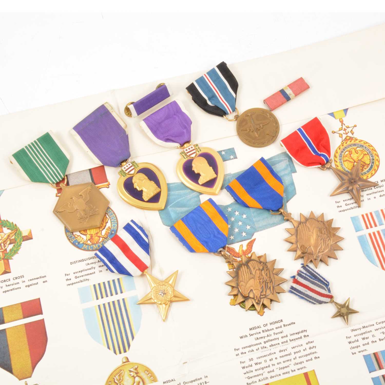 Lot 177 - Medals - Nine United States of America Decorations and Awards, and a wall chart.